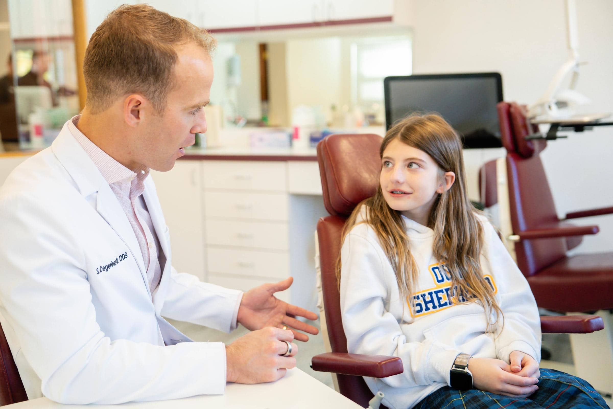 Patient smiling with braces at a Birmingham orthodontic office